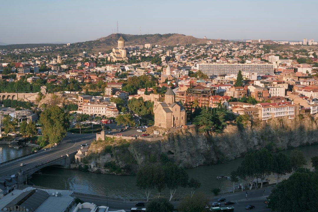 Tbilisi city street a view of a city with a river running through it